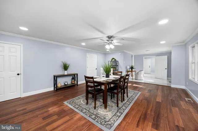 a bathroom with a bathtub a sink and a mirror