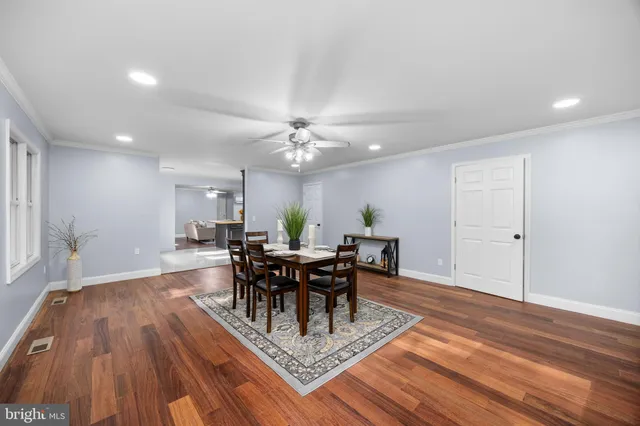 a white bath tub sitting next to a white toilet