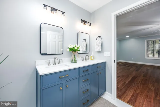 a white toilet sitting next to a bath tub