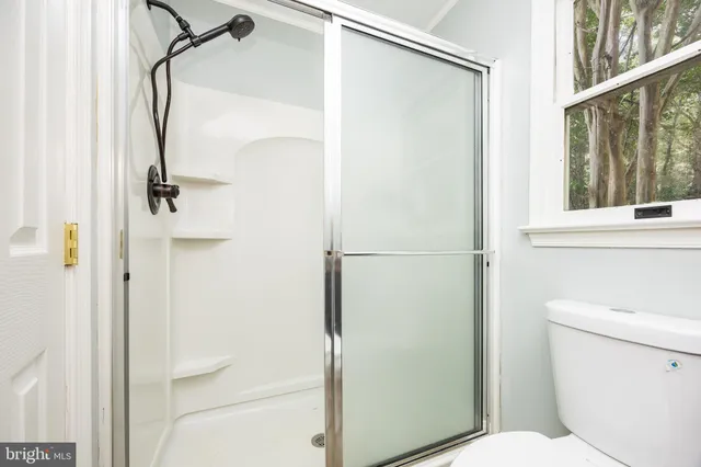 a view of a backyard with table and chairs