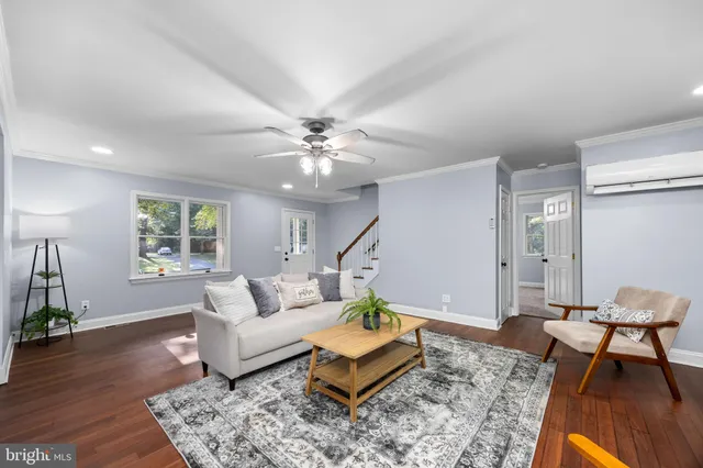 a kitchen with stainless steel appliances kitchen island granite countertop a table chairs stove and refrigerator