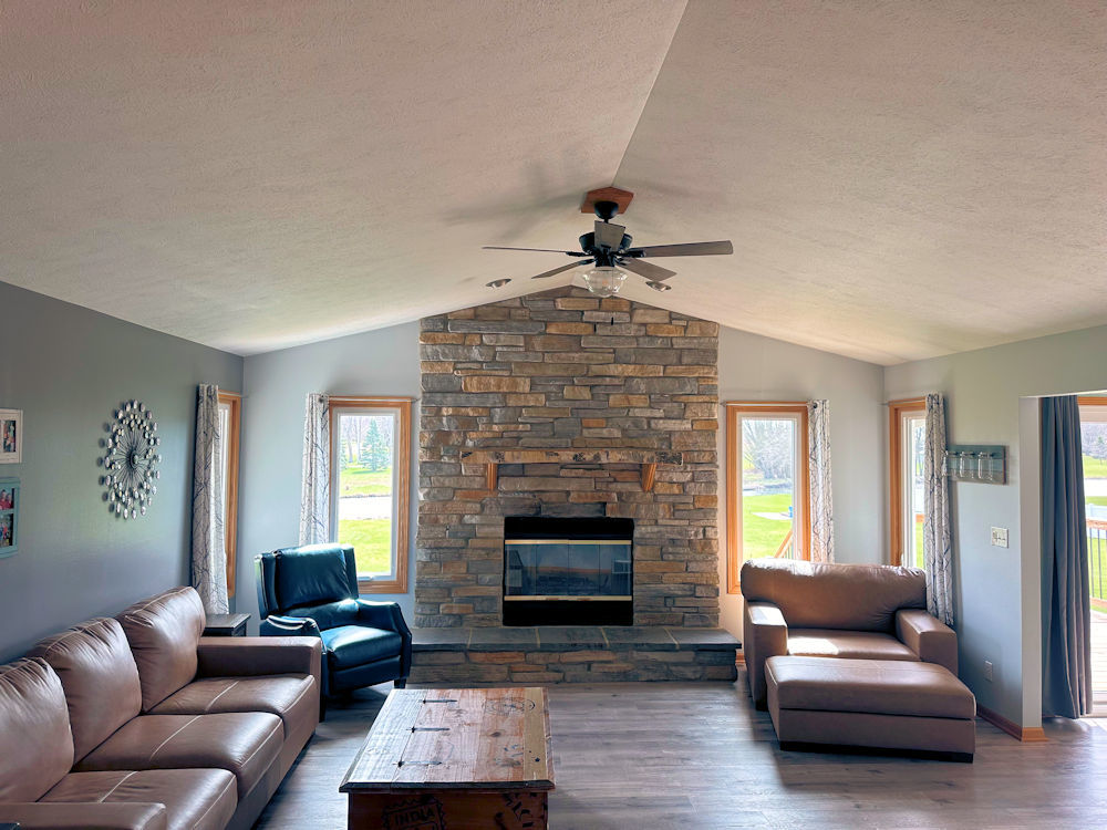 10965 Barron Road Chana, IL 61015 - Photo 6 of 27 a living room with furniture and a fireplace