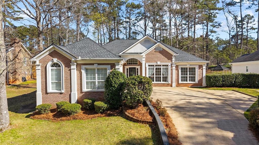 1030 Lakeview Parkway Villa Rica, GA 30180 - Photo 1 of 46 a front view of a house with a yard and porch