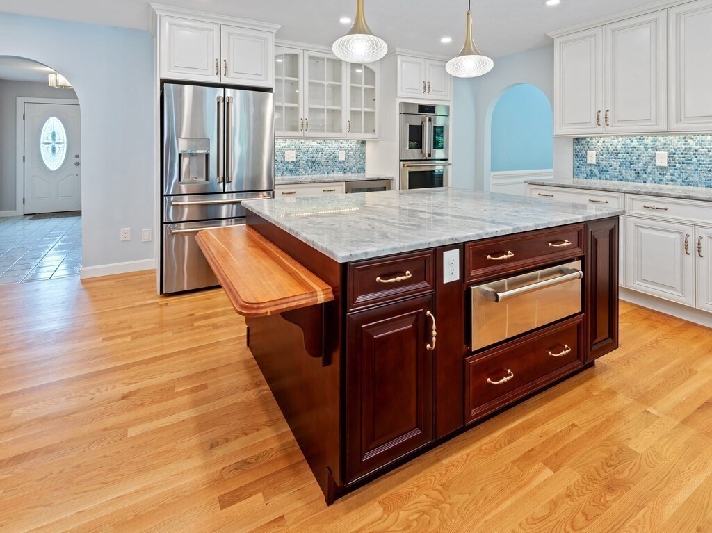 1 Corbin Road Dudley, MA 01571 - Photo 12 of 42 a kitchen with a wooden floor and a view of living room