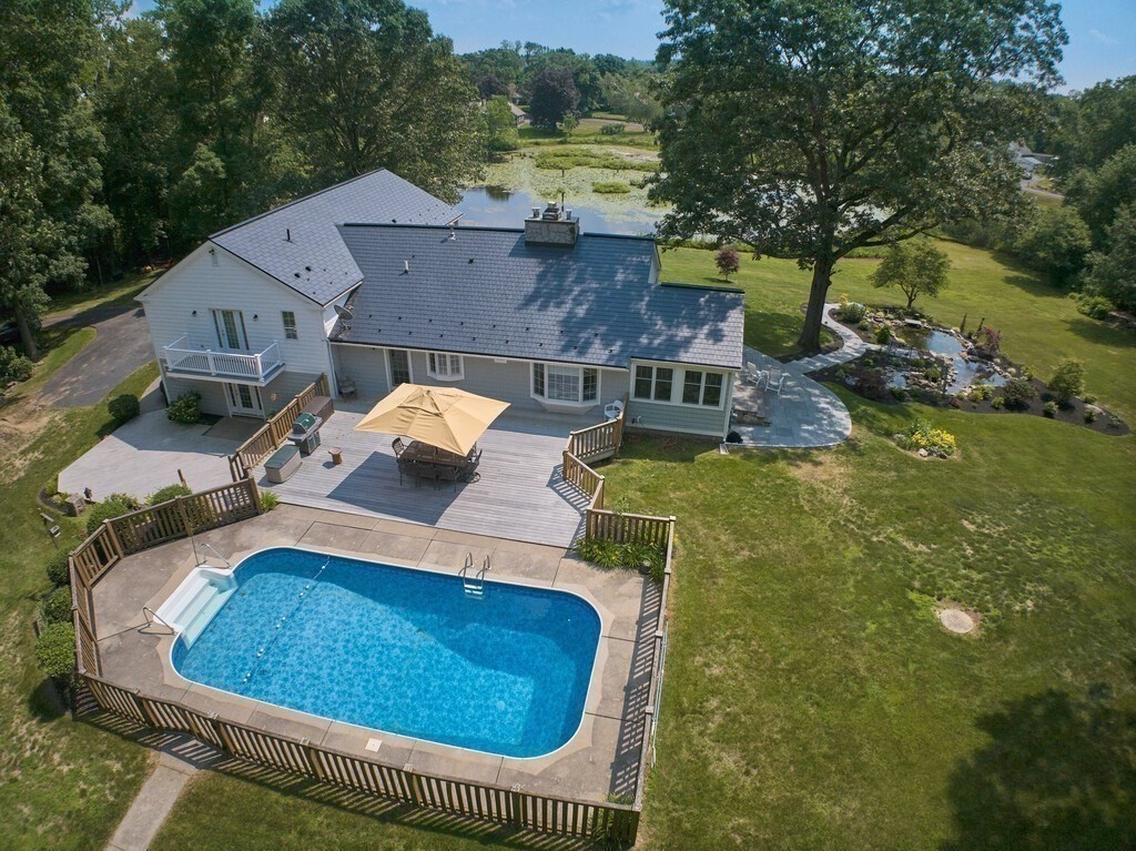 1 Corbin Road Dudley, MA 01571 - Photo 16 of 42 an aerial view of a house with swimming pool and big yard