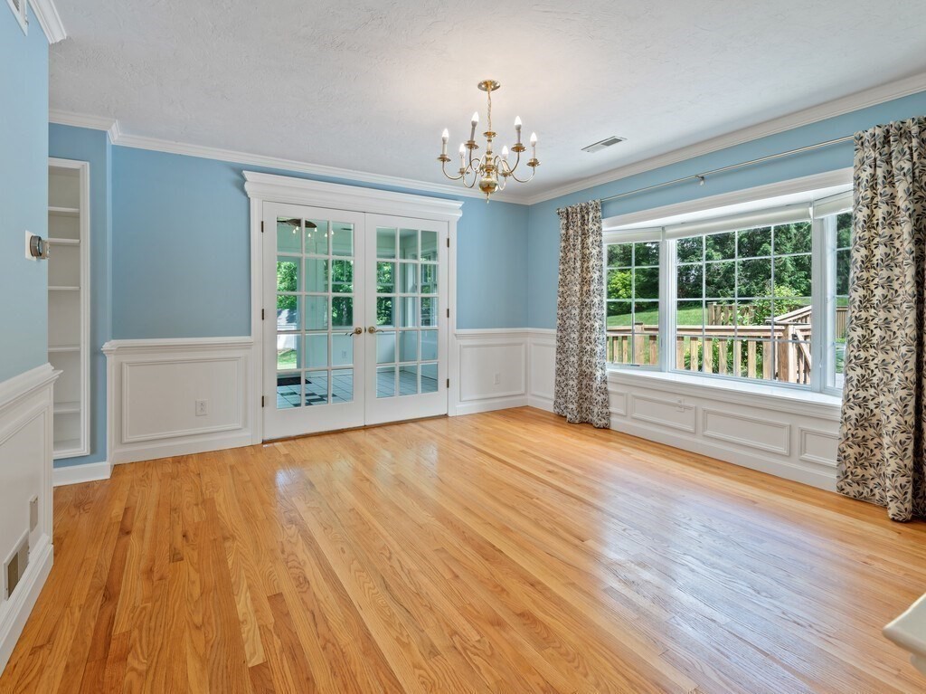 1 Corbin Road Dudley, MA 01571 - Photo 18 of 42 a view of an empty room with wooden floor and a window