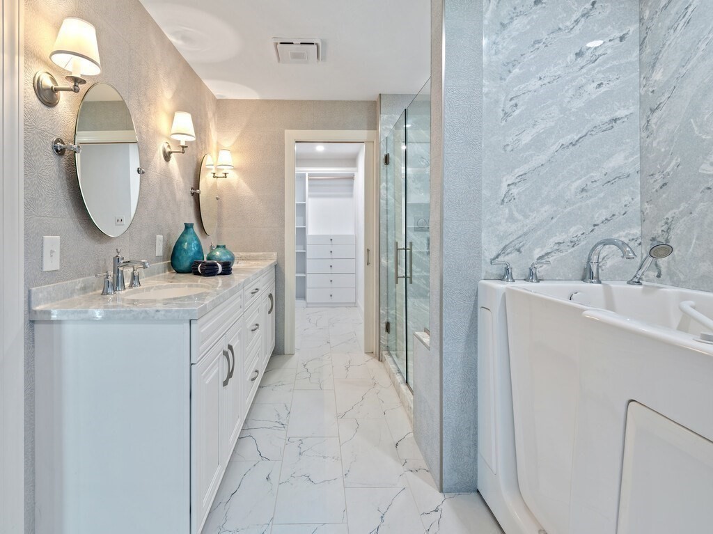 1 Corbin Road Dudley, MA 01571 - Photo 27 of 42 a bathroom with a double vanity sink mirror and a shower