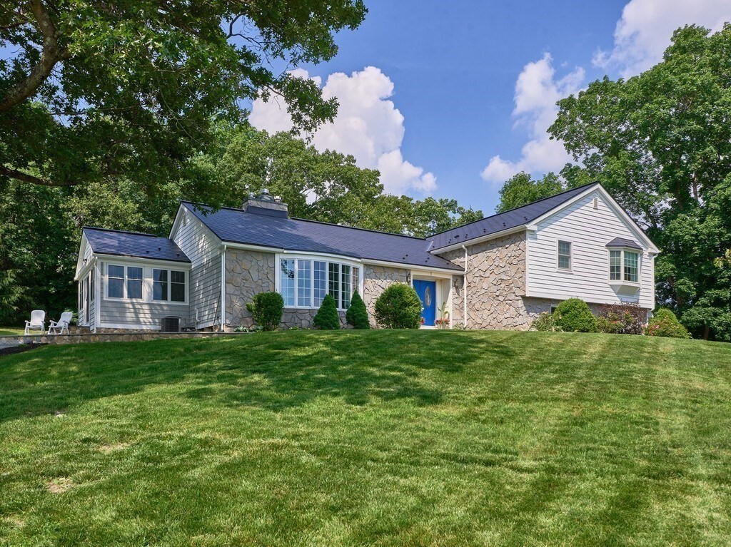 1 Corbin Road Dudley, MA 01571 - Photo 39 of 42 a view of a house with a big yard potted plants and large tree