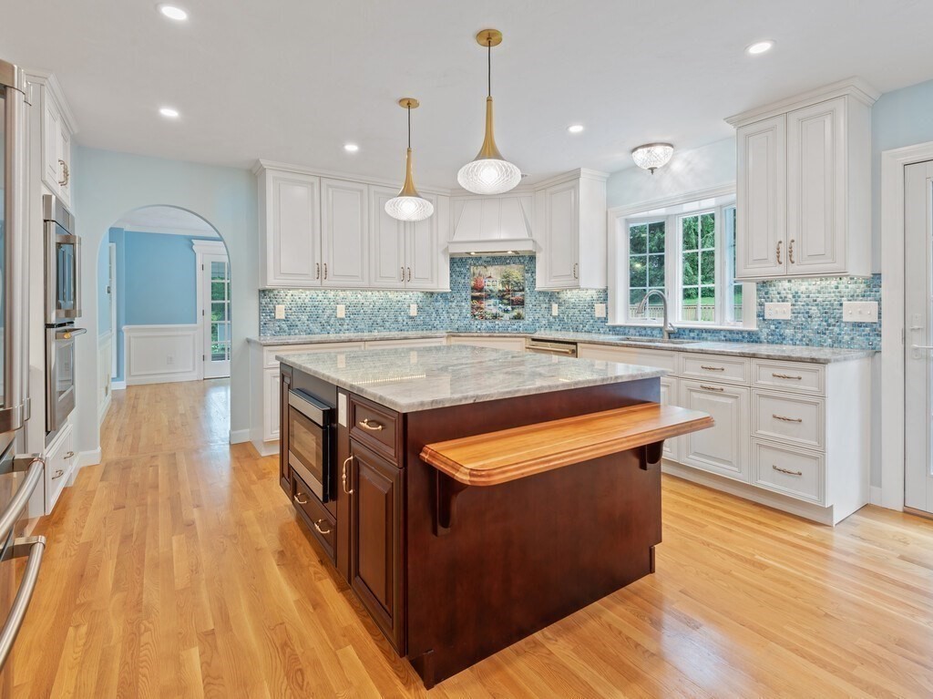 1 Corbin Road Dudley, MA 01571 - Photo 9 of 42 a kitchen with stainless steel appliances granite countertop wooden floors and sink