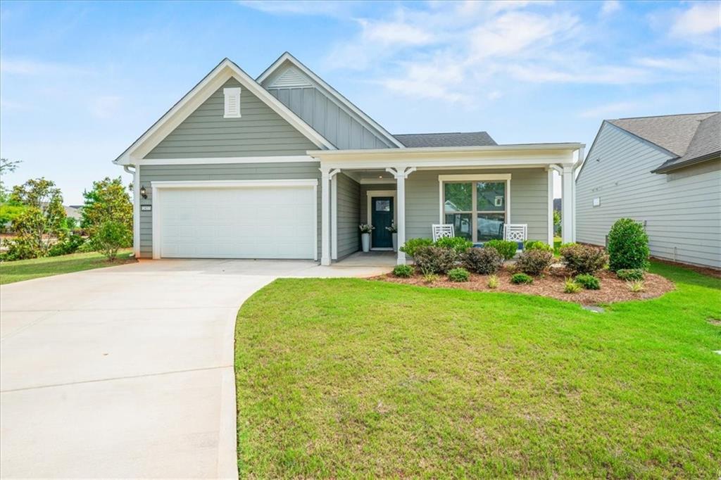 2457 Naples Street Hoschton, GA 30548 - Photo 41 of 41 a front view of a house with garden