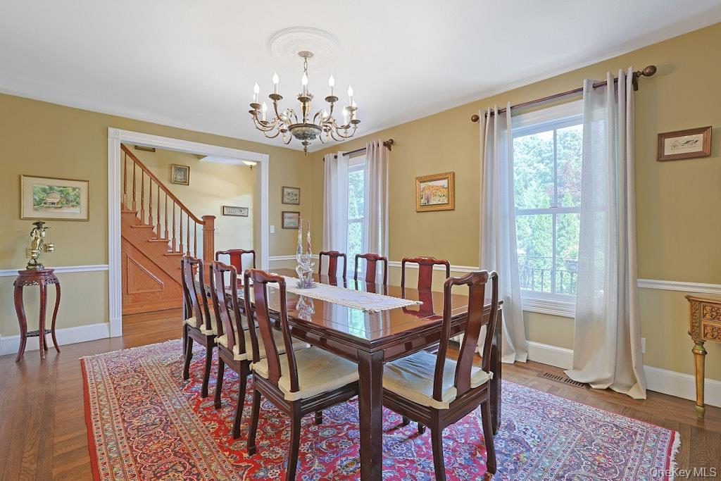 97 Underhill Road Scarsdale, NY 10583 - Photo 12 of 39 a view of a dining room with furniture window and wooden floor