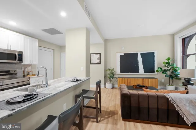 a bedroom with a bed and flat screen tv