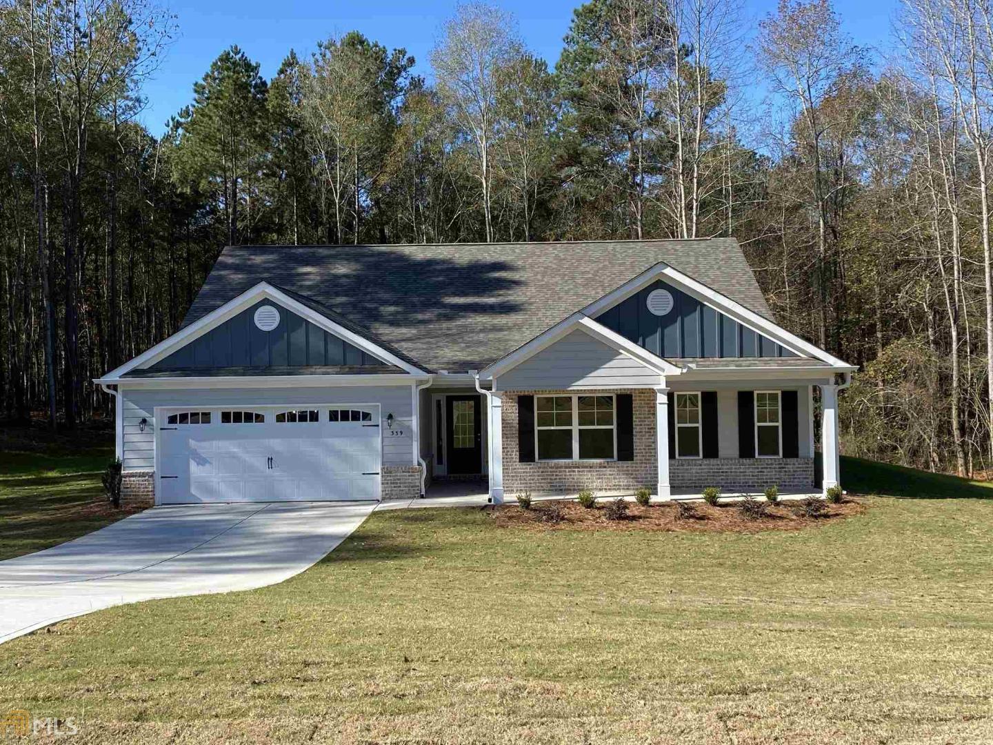 339 Lokeys Lane, Unit 34 Bethlehem, GA 30620 - Photo 1 of 1 a front view of a house with a yard