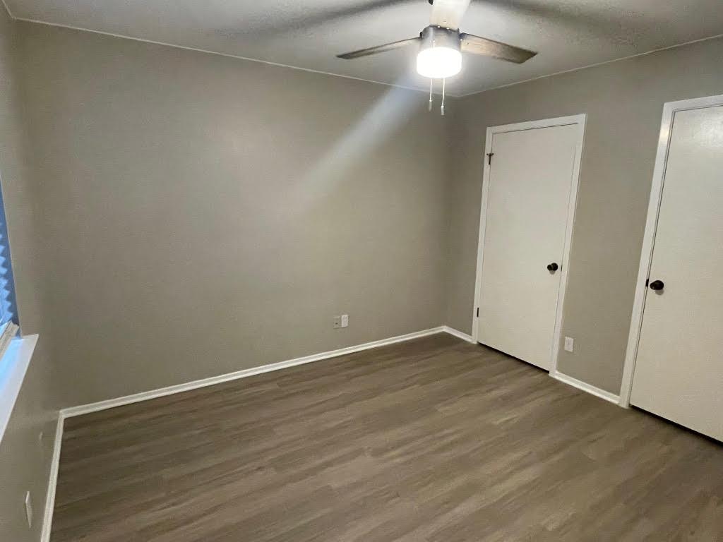 8105 Ceberry Drive, Unit B Austin, TX 78759 - Photo 6 of 12 a view of an empty room with wooden floor