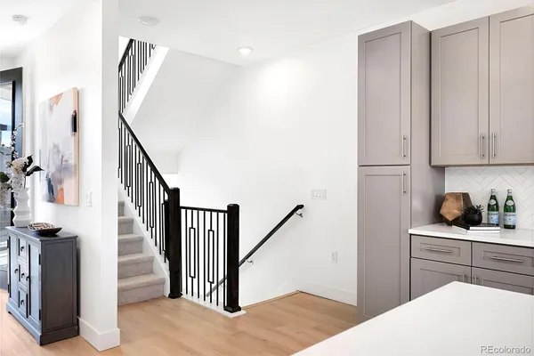 a kitchen with stainless steel appliances white cabinets and a stove
