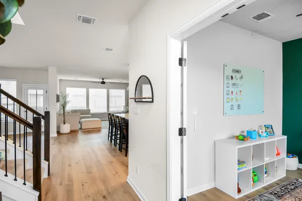a bedroom with furniture and a window