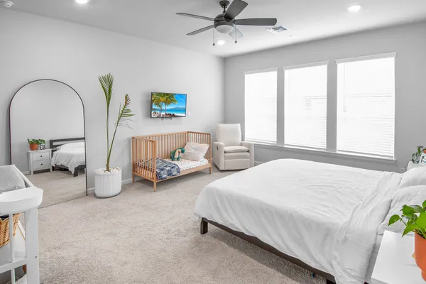 a bathroom with a double vanity sink a mirror and a shower