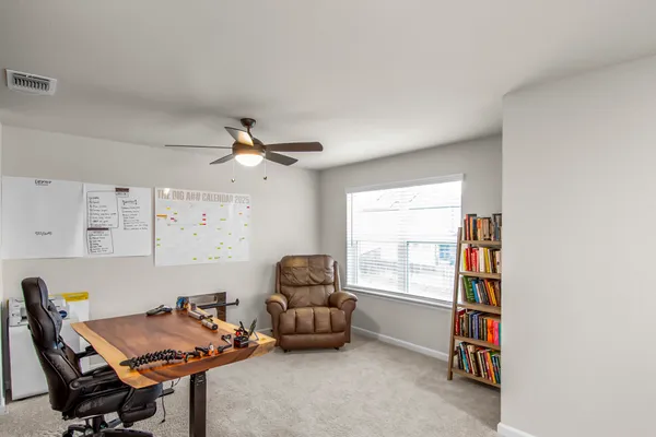 a bedroom with a bed and a couch