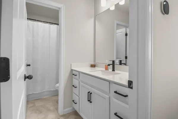 a front view of a house with outdoor seating