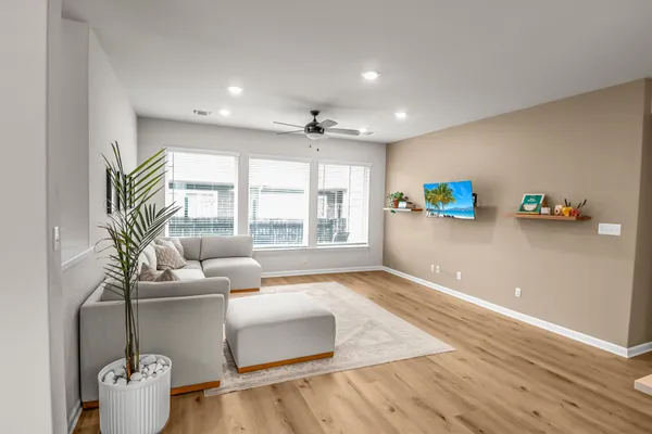 a living room with furniture and a large window