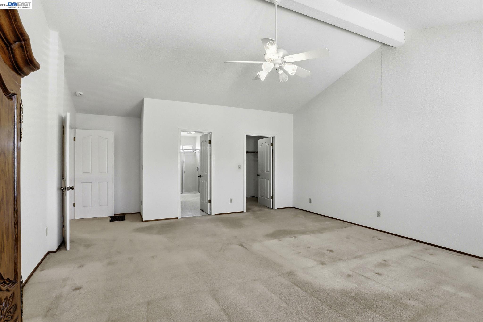 559 Cherry Way Hayward, CA 94541 - Photo 13 of 50 an empty room with chandelier fan and windows