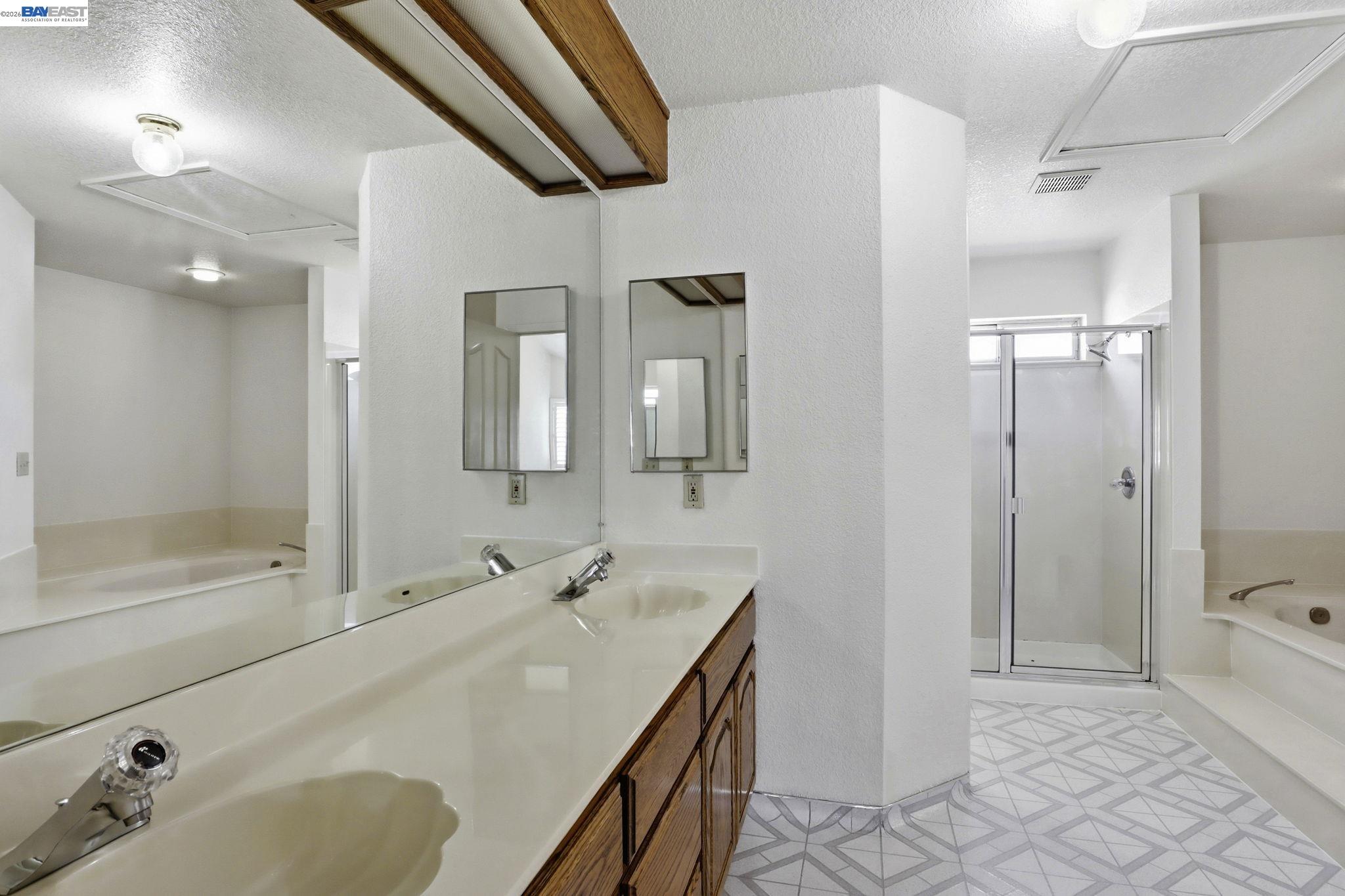 559 Cherry Way Hayward, CA 94541 - Photo 14 of 50 a bathroom with a sink and a mirror