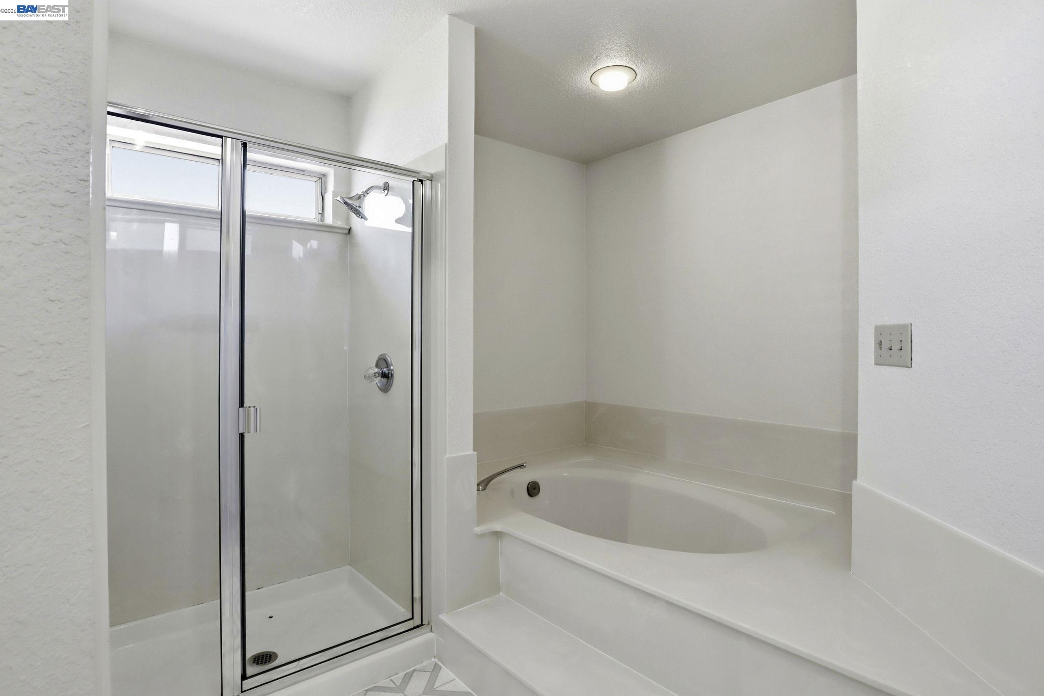559 Cherry Way Hayward, CA 94541 - Photo 15 of 50 a bathroom with a bathtub and a shower