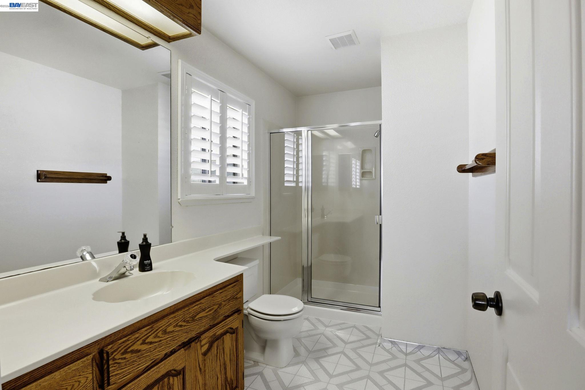 559 Cherry Way Hayward, CA 94541 - Photo 18 of 50 a bathroom with a sink toilet and shower