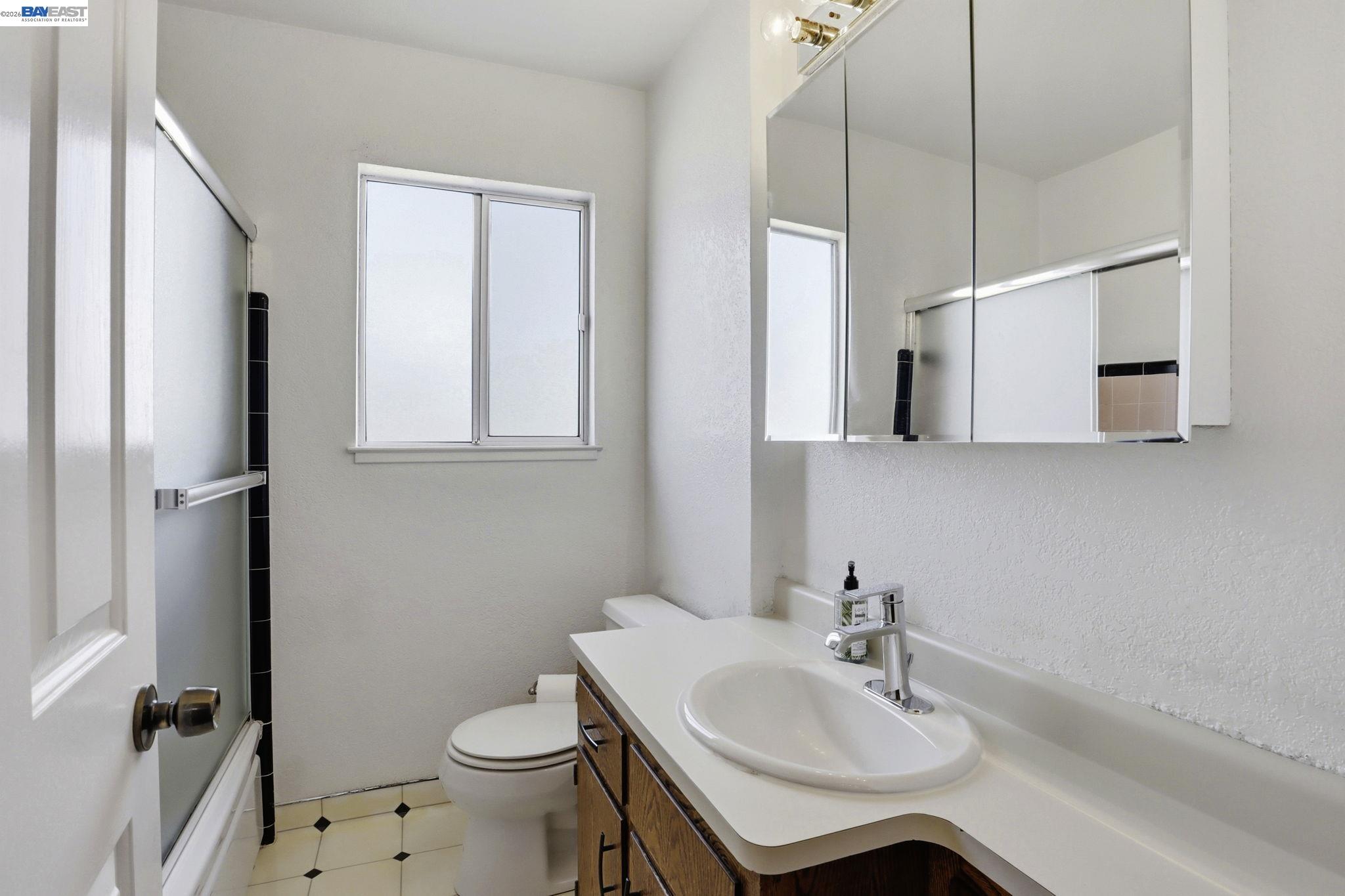559 Cherry Way Hayward, CA 94541 - Photo 21 of 50 a bathroom with a sink toilet and shower