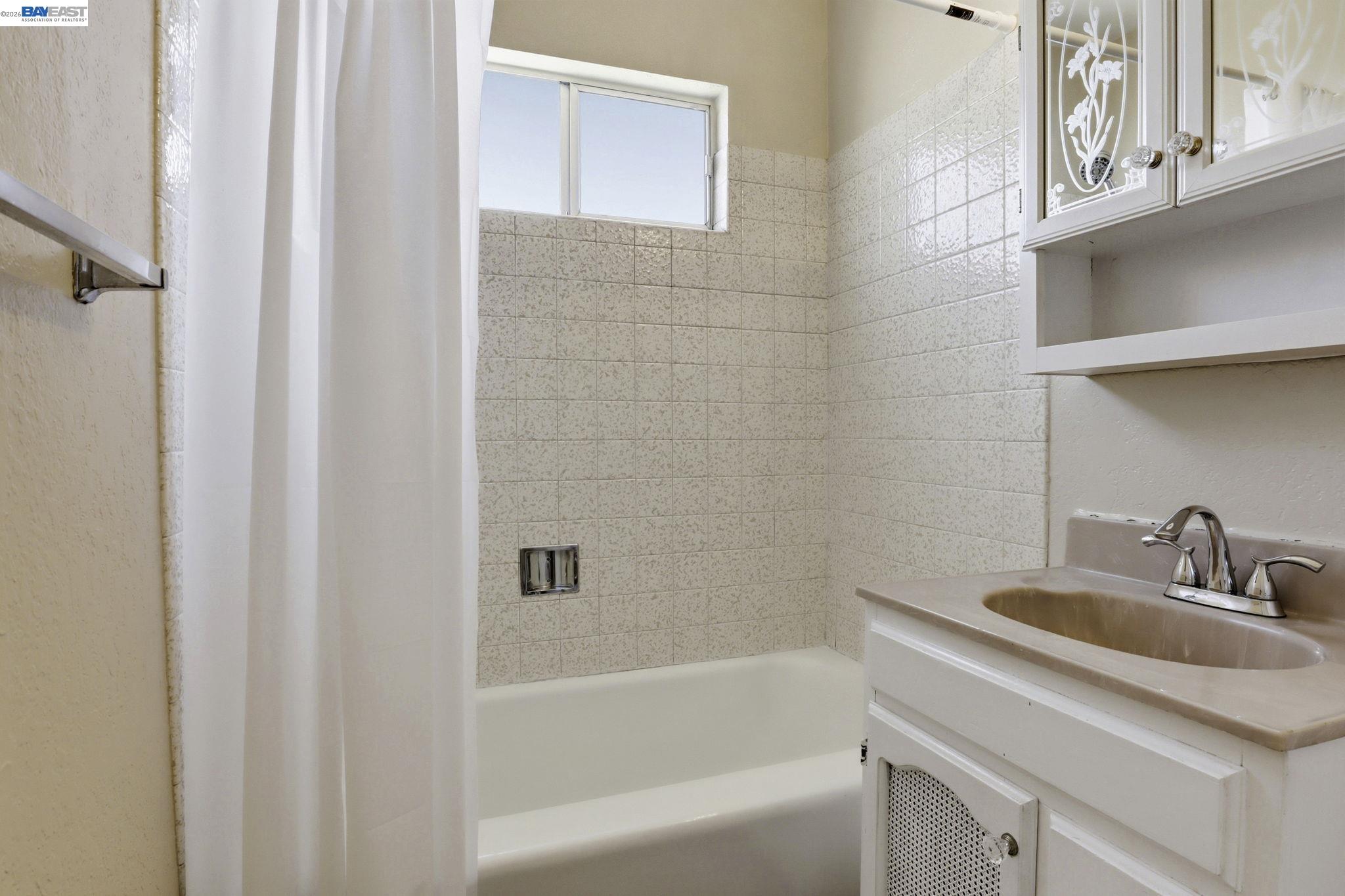 559 Cherry Way Hayward, CA 94541 - Photo 45 of 50 a bathroom with a sink and a bathtub