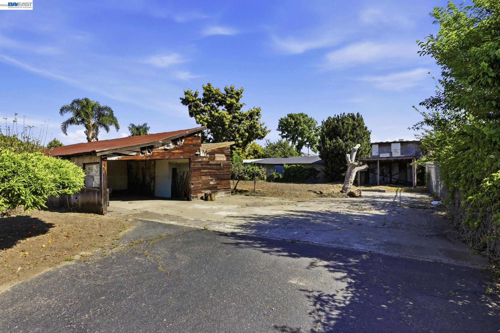 559 Cherry Way Hayward, CA 94541 - Photo 48 of 50 a front view of a house with a yard and a garage