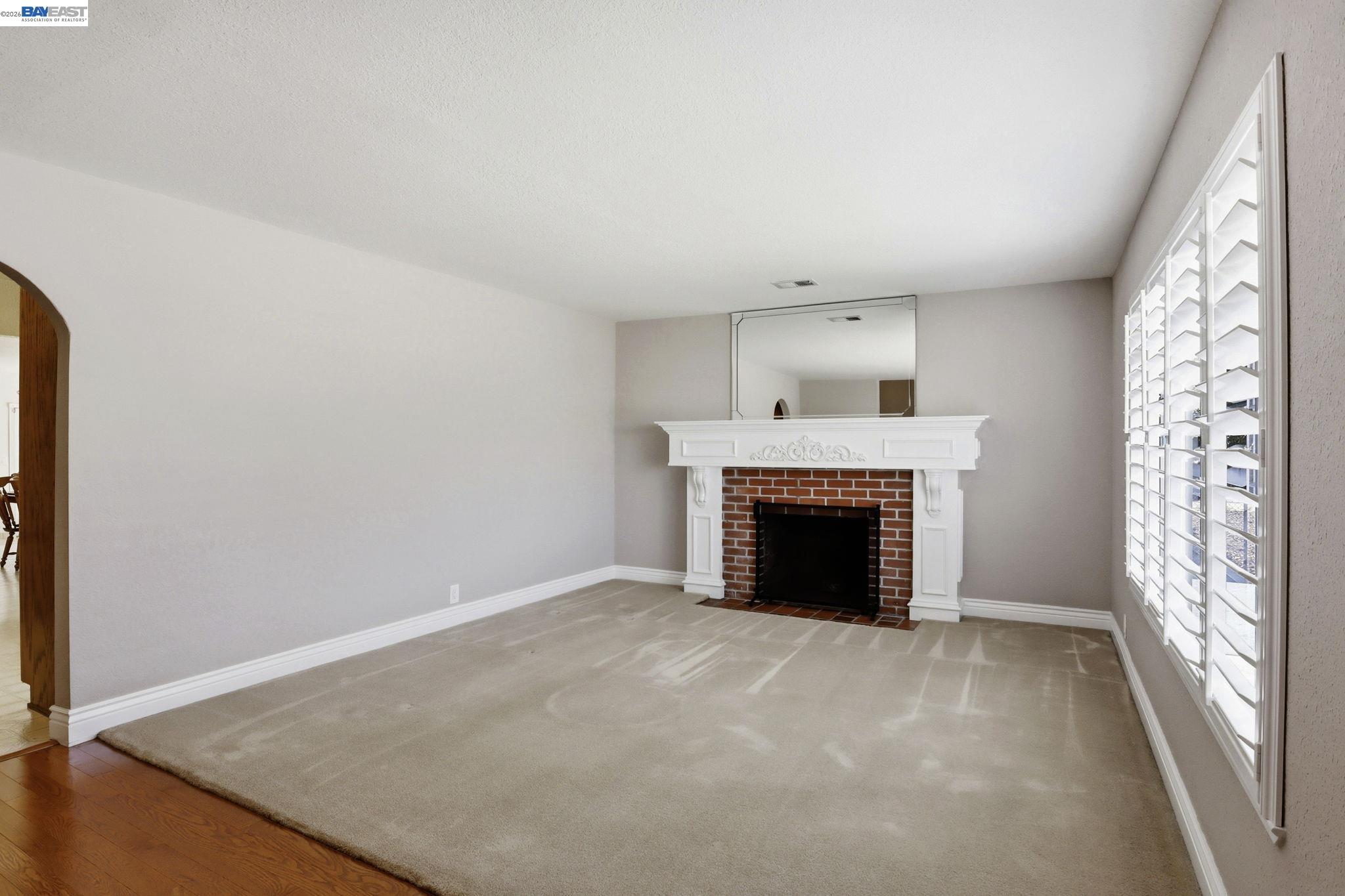 559 Cherry Way Hayward, CA 94541 - Photo 6 of 50 wooden floor fireplace and windows in an empty room
