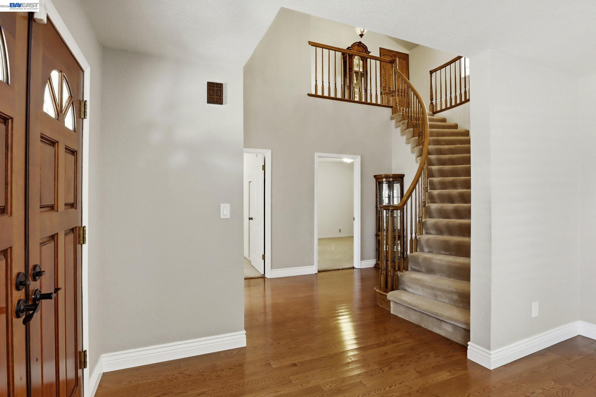 559 Cherry Way Hayward, CA 94541 - Photo 8 of 50 a view of a hallway with wooden floor and entryway