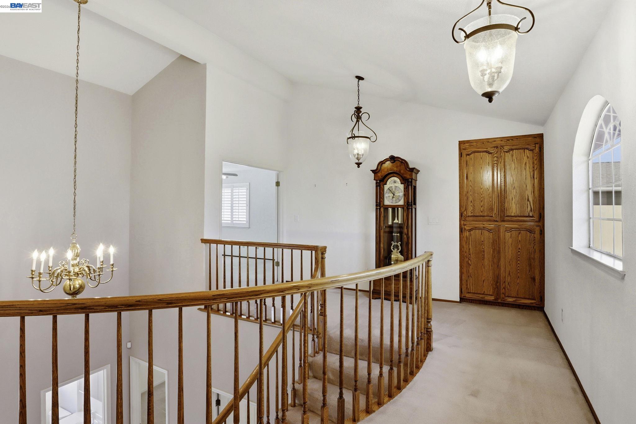 559 Cherry Way Hayward, CA 94541 - Photo 10 of 50 a view of staircase with railing and chandelier