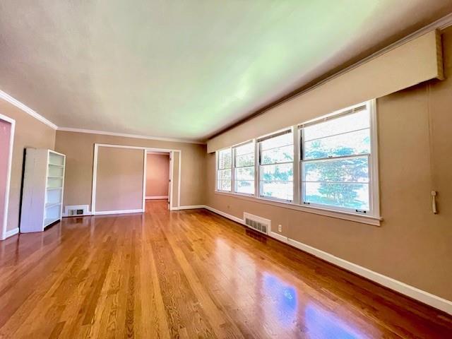 2396 Lavista Road Northeast Atlanta, GA 30329 - Photo 2 of 28 a view of an empty room with a window and wooden floor
