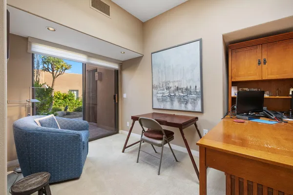 a work room with furniture and a window