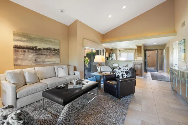 a living room with furniture and a large window