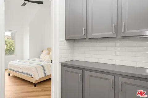 a room with a bed and a night stand