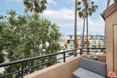 a view of balcony with furniture