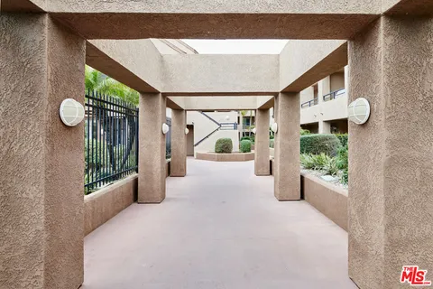 a front view of a building with a garden