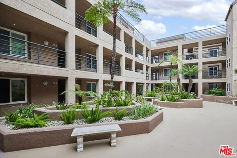 a view of a lake with a lawn chairs
