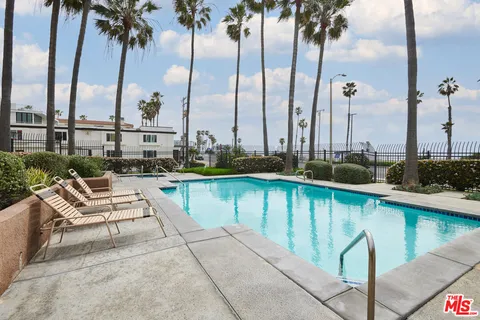 a front view of a building with a garden