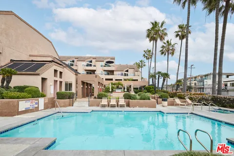 a view of a swimming pool with chairs
