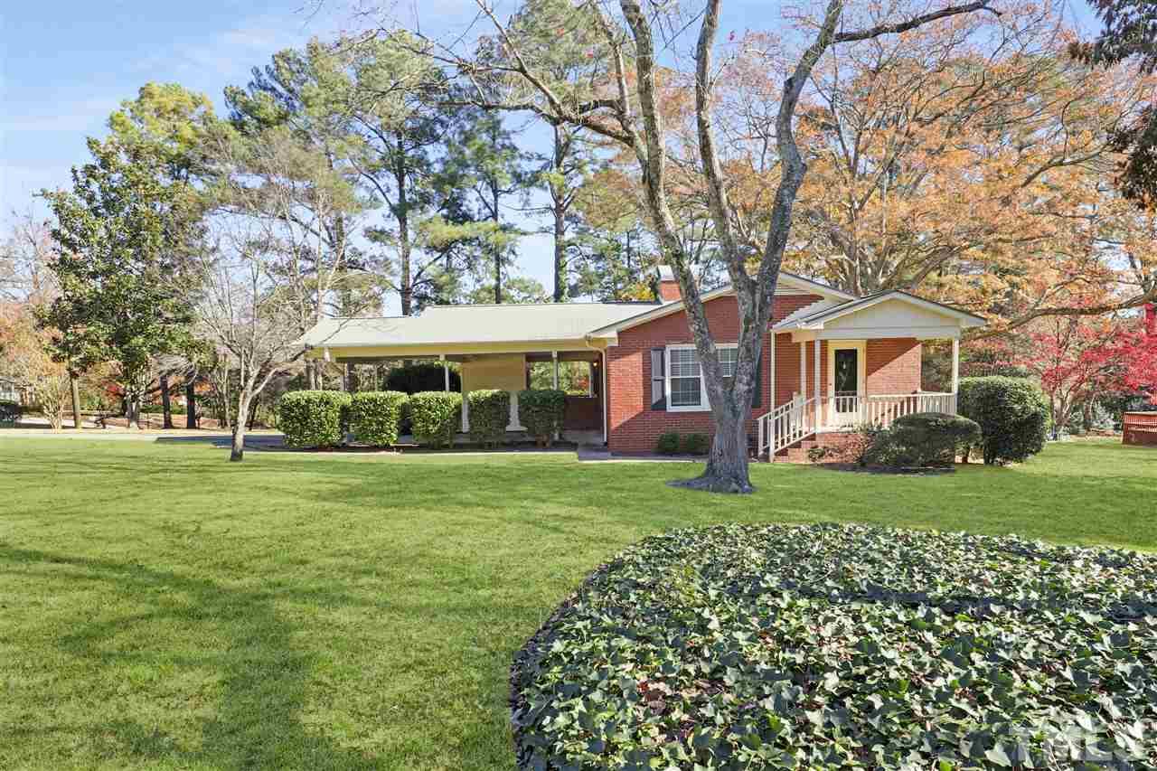 901 Merrie Road Raleigh, NC 27606 - Photo 1 of 18 front view of a house with a garden