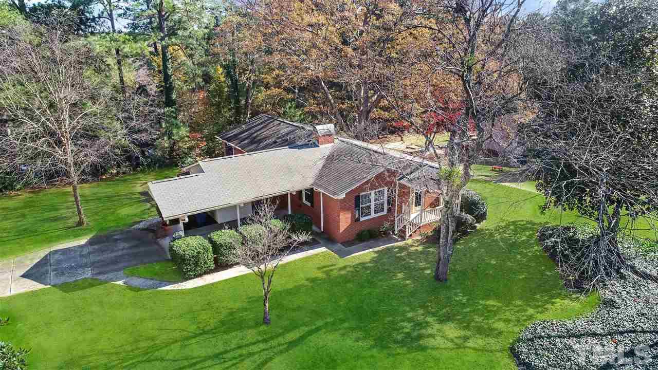 901 Merrie Road Raleigh, NC 27606 - Photo 2 of 18 aerial view of a house with a yard table and chairs