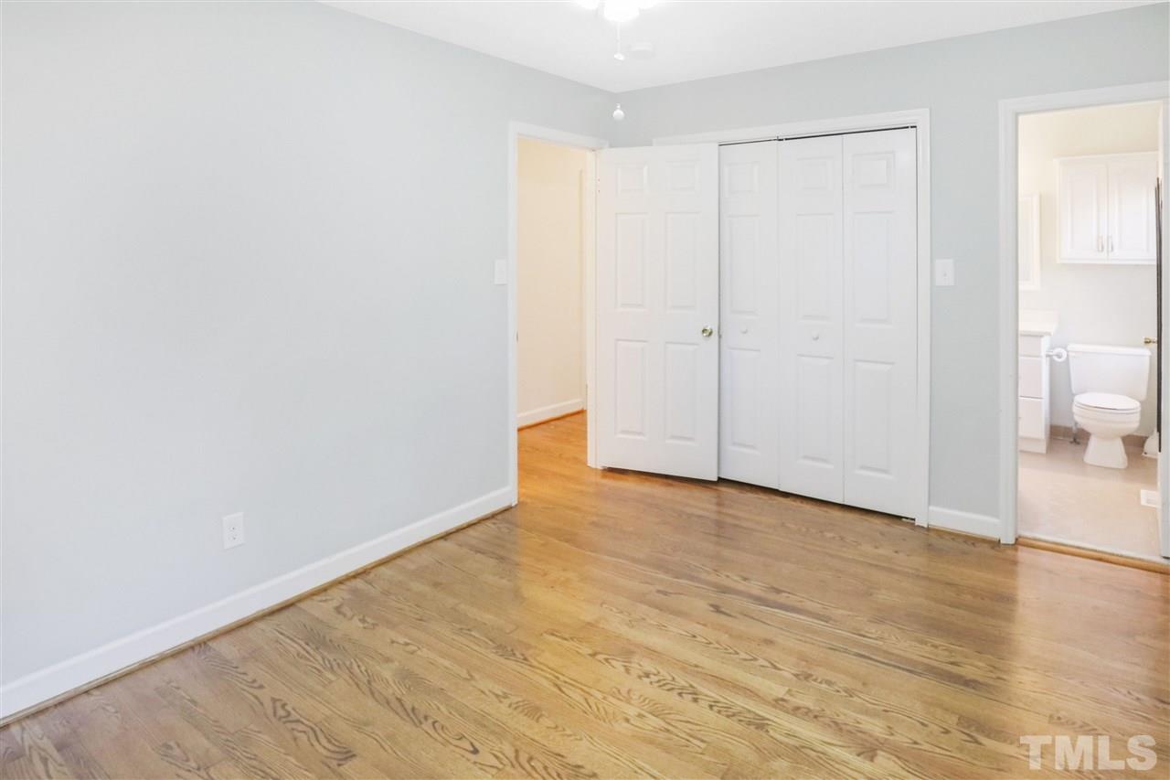 901 Merrie Road Raleigh, NC 27606 - Photo 10 of 18 a view of an empty room and wooden floor