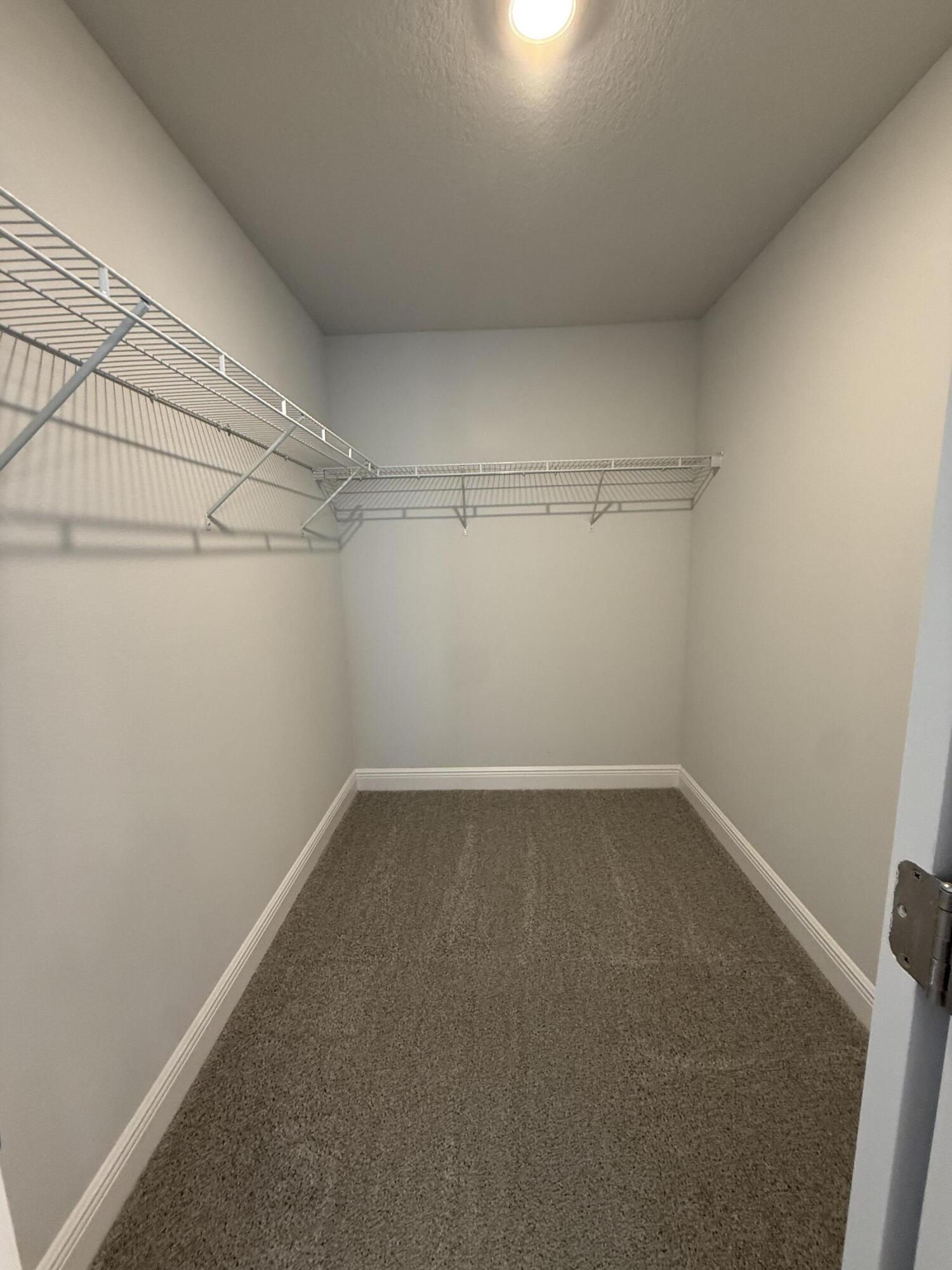 6014 Crocket Cove Crestview, FL 32539 - Photo 15 of 29 a view of a room with racks on the wall