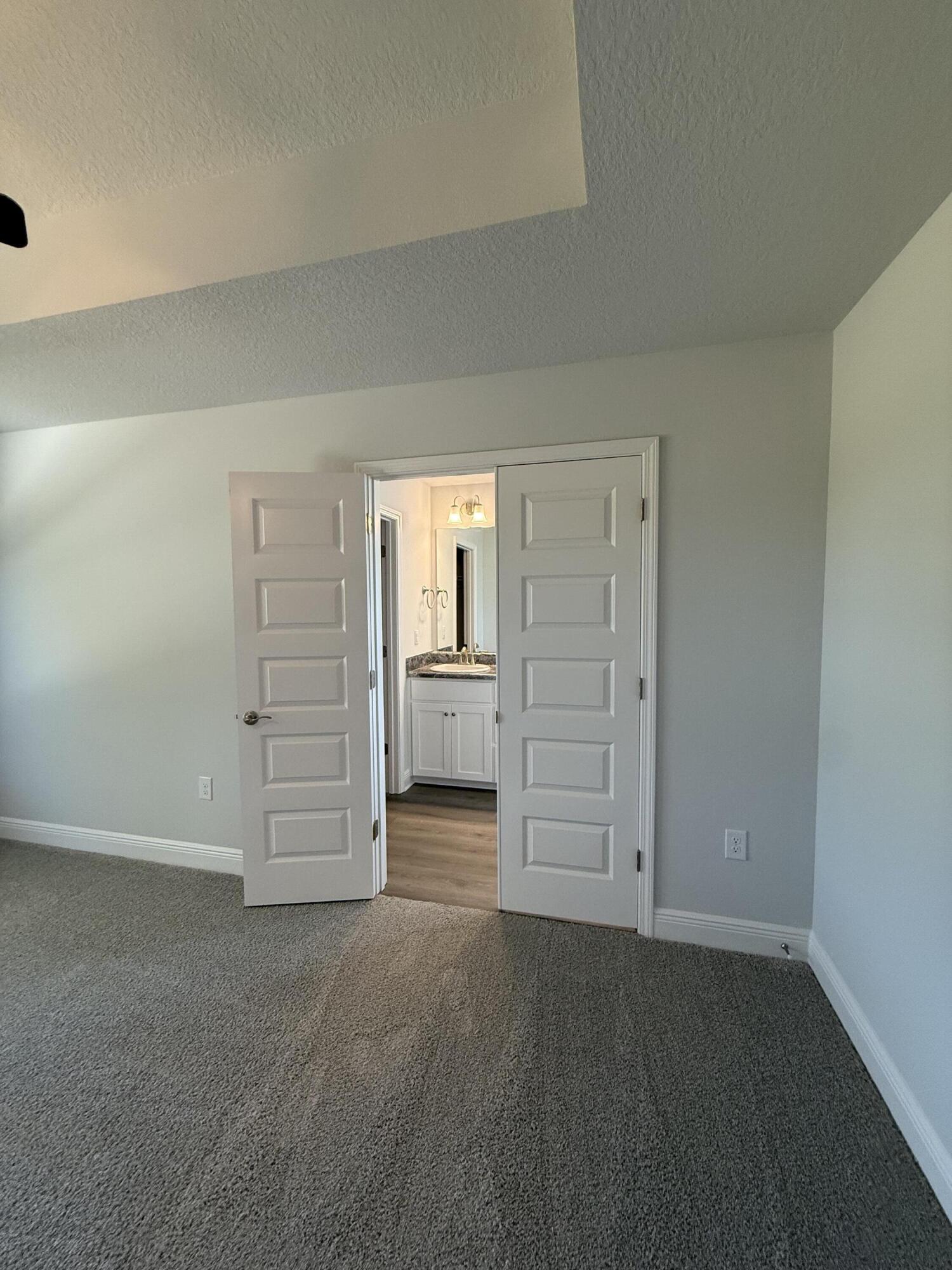 6014 Crocket Cove Crestview, FL 32539 - Photo 16 of 29 an empty room with closet and natural light