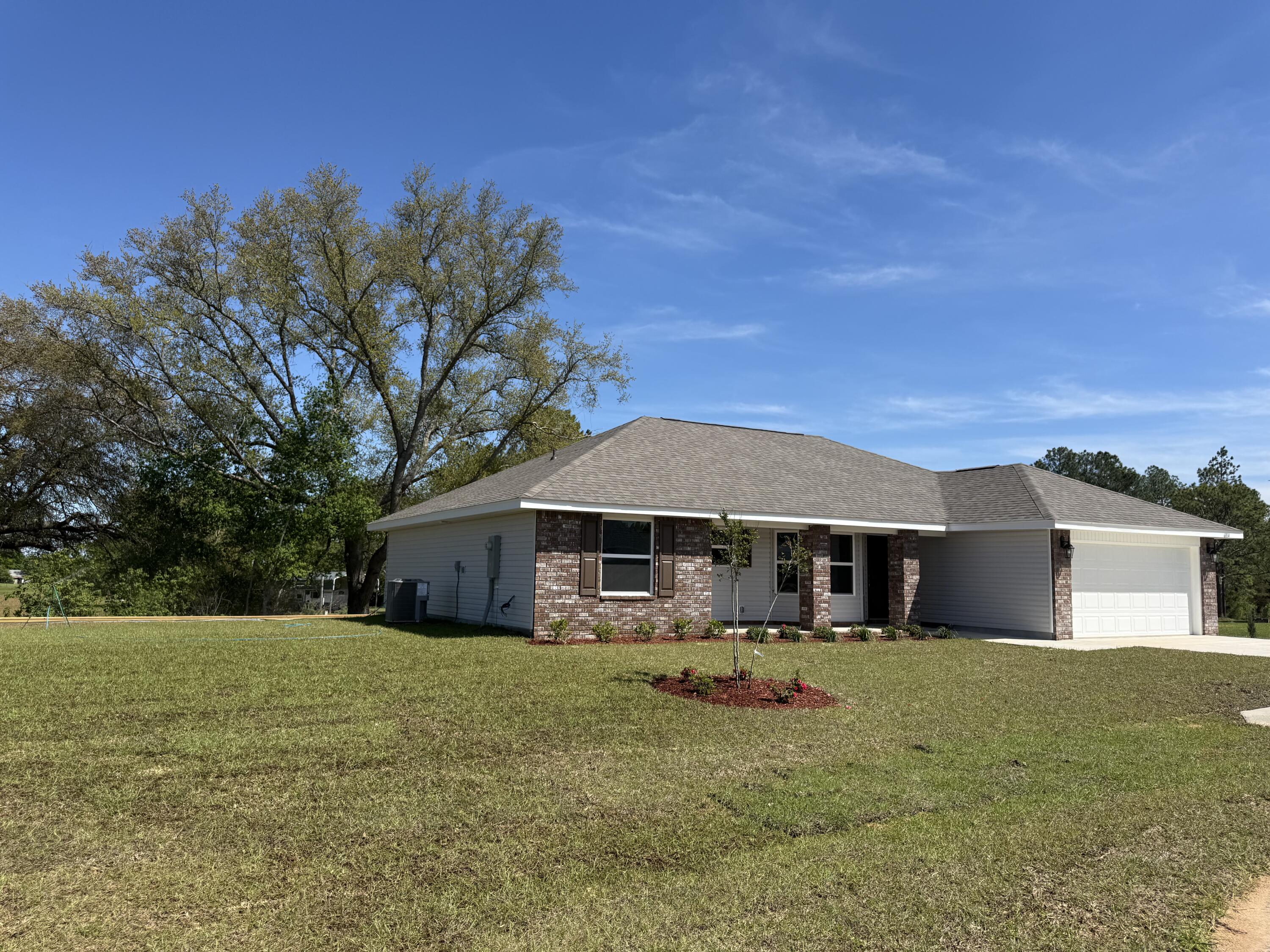 6014 Crocket Cove Crestview, FL 32539 - Photo 5 of 29 a front view of a house with a yard