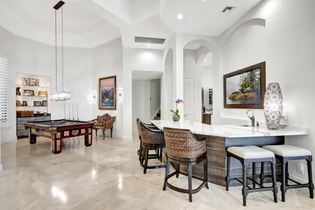 a kitchen with stainless steel appliances granite countertop a stove and a microwave